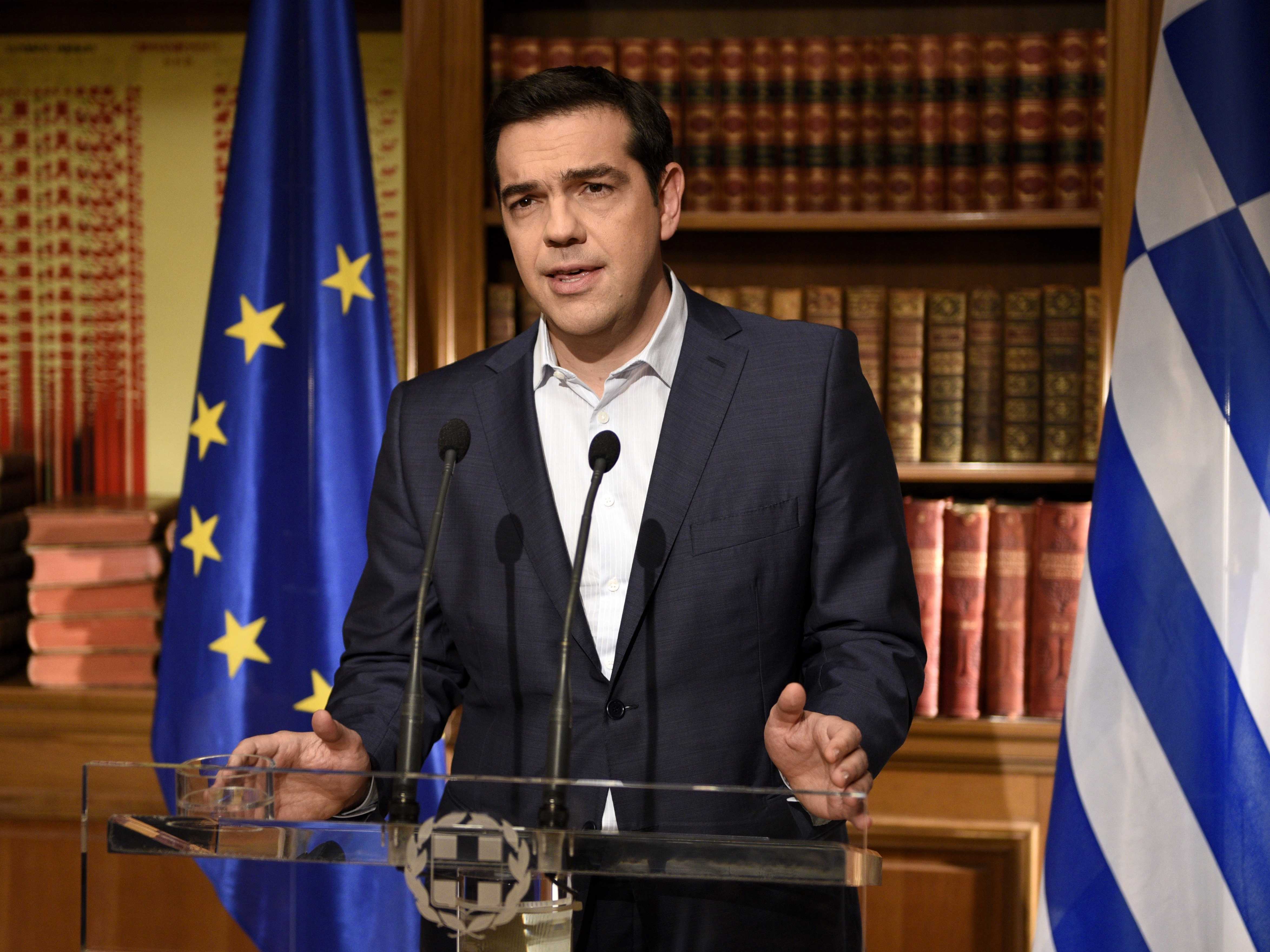 Greek Prime Minister Alexis Tsirpas delivers a televised address to the nation from his office at Maximos Mansion